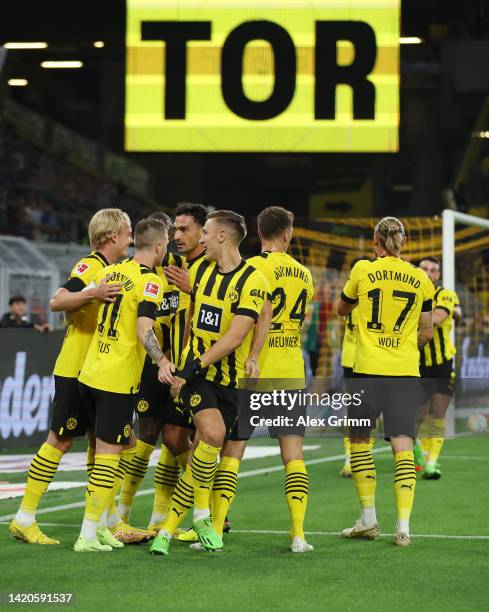 Marco Reus of Borussia Dortmund celebrates their team's first goal with teammates during the Bundesliga match between Borussia Dortmund and TSG...