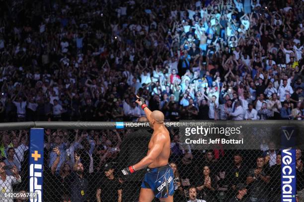 Ciryl Gane of France celebrates his victory over Tai Tuivasa of Australia in a heavyweight fight during the UFC Fight Night event at The Accor Arena...