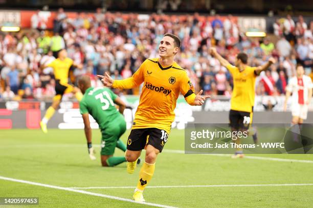 Daniel Podence of Wolverhampton Wanderers celebrates after scoring his team's first goal during the Premier League match between Wolverhampton...