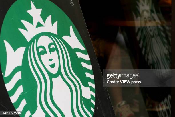 Starbucks logo is seen in Times Square on September 3, 2022 in New York City. The Department of Consumer and Worker Protection has sued Starbucks for...