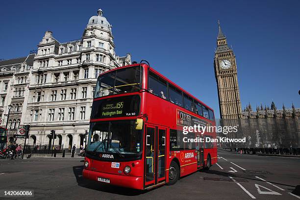 Double decker bus makes its way past the Houses of Parliament on March 27, 2012 in London, England.