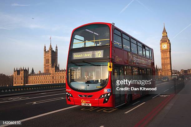 Double decker bus makes its way over Westminster Bridge, past the Houses of Parliament and Big Ben on March 28, 2012 in London, England.