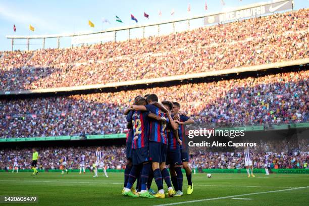 Robert Lewandowski of FC Barcelona celebrates with teammates after scoring the opening goal during the LaLiga Santander match between FC Barcelona...