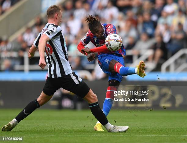 Crystal Palace striker Wilfried Zaha shoots at goal during the Premier League match between Newcastle United and Crystal Palace at St. James Park on...