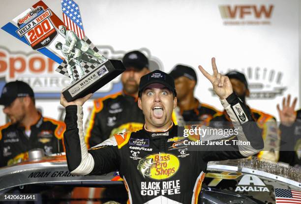 Noah Gragson, driver of the Bass Pro Shops/TrueTimber/BRCC Chevrolet, celebrates in victory lane after winning the NASCAR Xfinity Series Sport Clips...