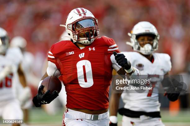 Braelon Allen of the Wisconsin Badgers rushes for a 96-yard touchdown run in the second quarter against the Illinois State Redbirds at Camp Randall...
