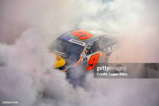 Noah Gragson, driver of the Bass Pro Shops/TrueTimber/BRCC Chevrolet, celebrates with a burnout after winning the NASCAR Xfinity Series Sport Clips...