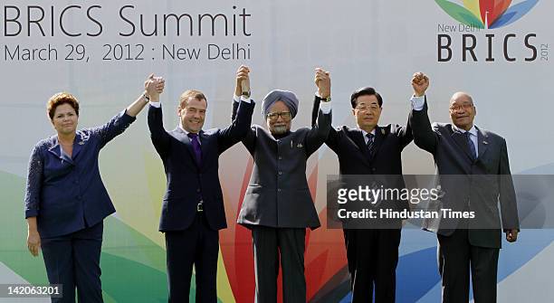 Brazil's President Dilma Rousseff, Russian President Dmitry Medvedev, Prime Minister Manmohan Singh, Chinese President Hu Jintao and South African...