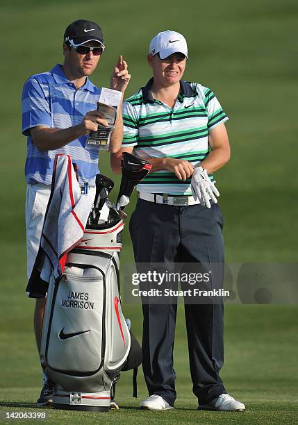 James Morrison of England ponders a shot with his caddie during the first round of the Sicilian Open at Verdura Golf and Spa Resort on March 29, 2012...