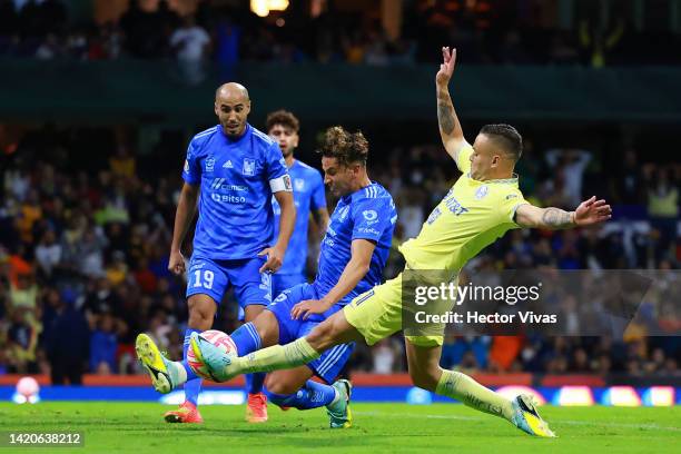 Igor Lichnovsky of Tigres battles for possession with Jonathan Rodriguez of America during the 12th round match between America and Tigres UANL as...