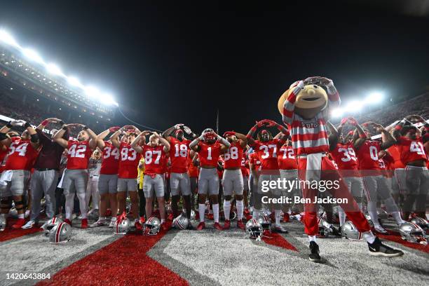 Brutus and The Ohio State Buckeyes take part in singing "Carmen Ohio" following a 21-10 victory over the Notre Dame Fighting Irish at Ohio Stadium on...