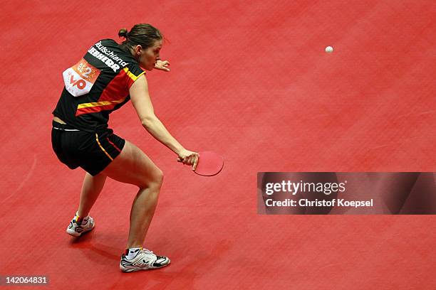 Irene Ivancan of Germany plays a backhand during her match against Kim Jong of North Korea during the LIEBHERR table tennis team world cup 2012...