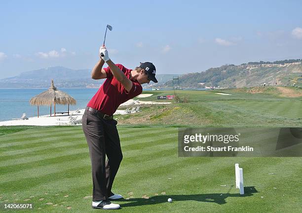 Nicolas Colsaerts of Belgium plays a shot during the first round of the Sicilian Open at Verdura Golf and Spa Resort on March 29, 2012 in Sciacca,...