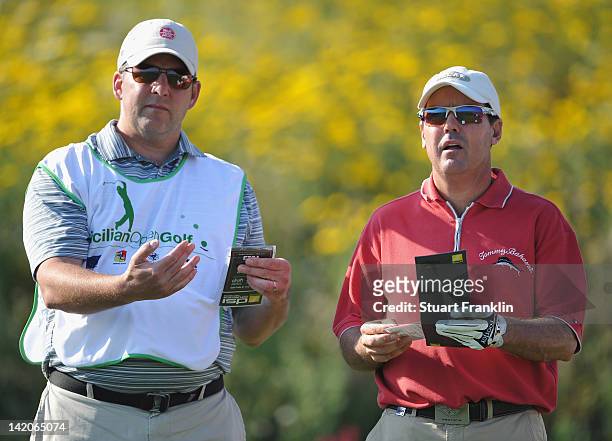 Rich Beem of USA and caddie ponder a shot during the first round of the Sicilian Open at Verdura Golf and Spa Resort on March 29, 2012 in Sciacca,...