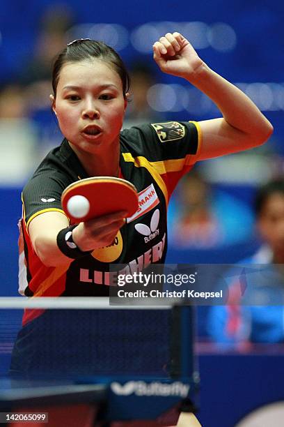 Wu Jiaduo of Germany plays a backhand during her match against Kim Hye Song of North Korea during the LIEBHERR table tennis team world cup 2012...