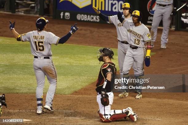 Tyrone Taylor of the Milwaukee Brewers celebrates with Esteury Ruiz after hitting a two-run home run against the Arizona Diamondbacks during the 10th...
