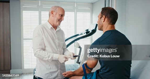 Sports doctor, fitness man or blood test doping in wellness clinic, health or consulting room. Healthcare professional in medical science research for athlete patient for workout or exercise training Sports doctor, fitness man or blood test doping in wellness clinic, health or consulting room. Healthcare professional in medical science research for athlete patient for workout or exercise training