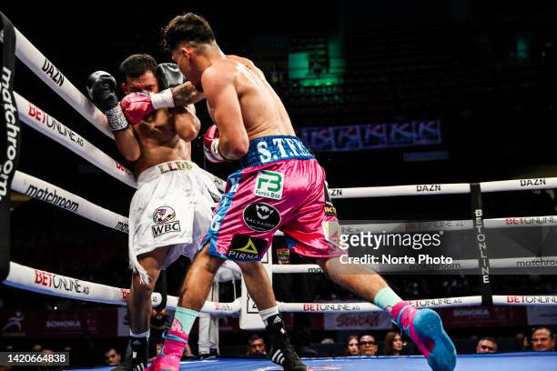 Irvin 'Turru' Turrubiartes fights against Eduardo 'Rocky' Hernandez during their WBC Super Featherweight Silver International Championship bout on...