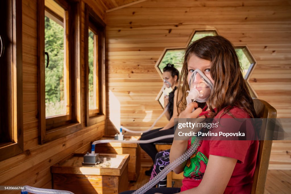 Inhalinng Child Inhaling Air From The Bees House High-Res Stock Photo - Getty Images