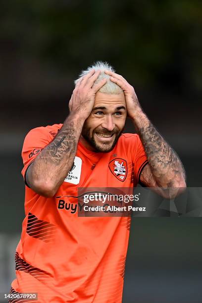 Charlie Austin of the Roar reacts after his penalty kick is saved by Matthew Acton of the Victory during the A-Leagues Men Pre-Season match between...