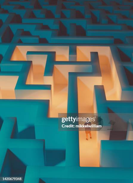 woman trapped in a maze is looking for a way out - escaping maze stock pictures, royalty-free photos & images