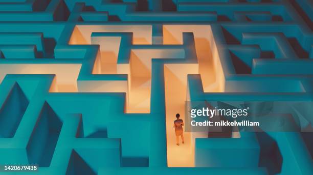 woman inside a maze tries to find the right way - fast forward bildbanksfoton och bilder