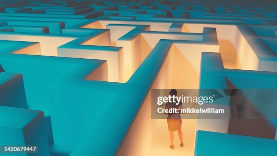 Woman looking for at way to escape maze Woman looking for at way to escape maze