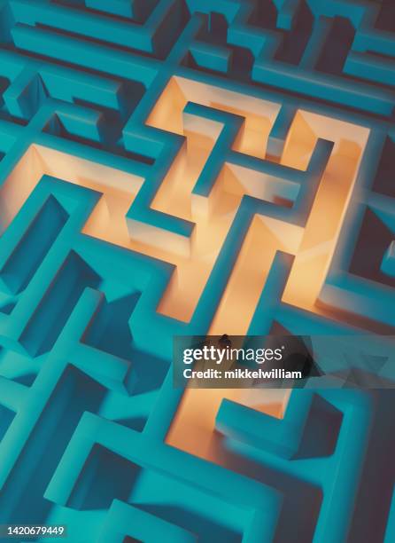 drone view of woman trapped inside a maze while trying to get out - labirinto imagens e fotografias de stock