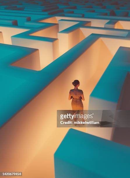 trapped in a maze a woman is looking for a way to get out - trapped business stock pictures, royalty-free photos & images
