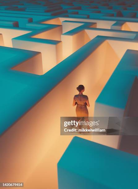 trapped in a maze a woman is looking for a way to get out - alternativ bildbanksfoton och bilder