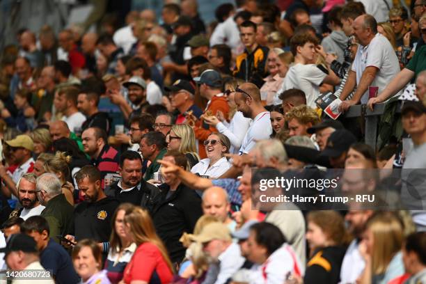 Fans of England react in the crowd during the Women's International match between England Red Roses and USA at Sandy Park on September 03, 2022 in...