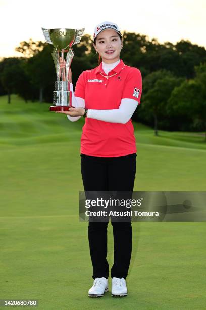 Yuting Seki of China poses with the trophy after winning the tournament following the final round of Golf5 Ladies at Golf5 Country Oak Village on...