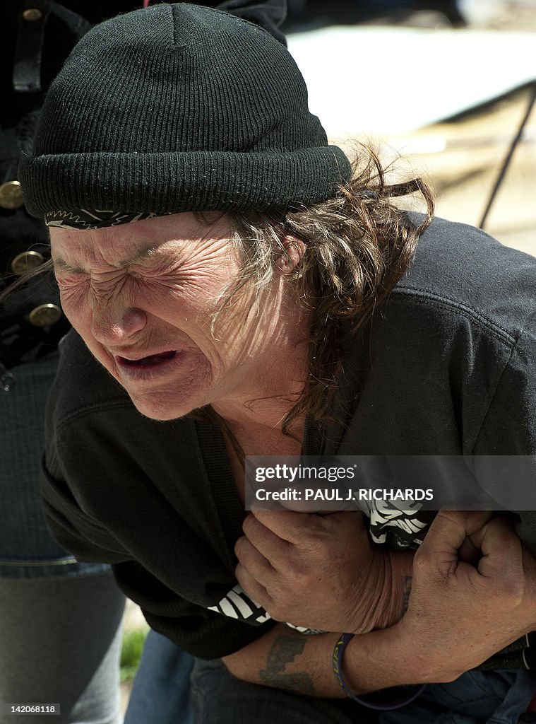 An Occupy DC protester cries in pain as