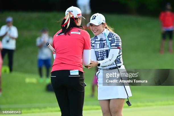 Yuting Seki of China is congratulated by Yuri Yoshida of Japan after winning the tournament through the playoff on the playoff second hole on the...
