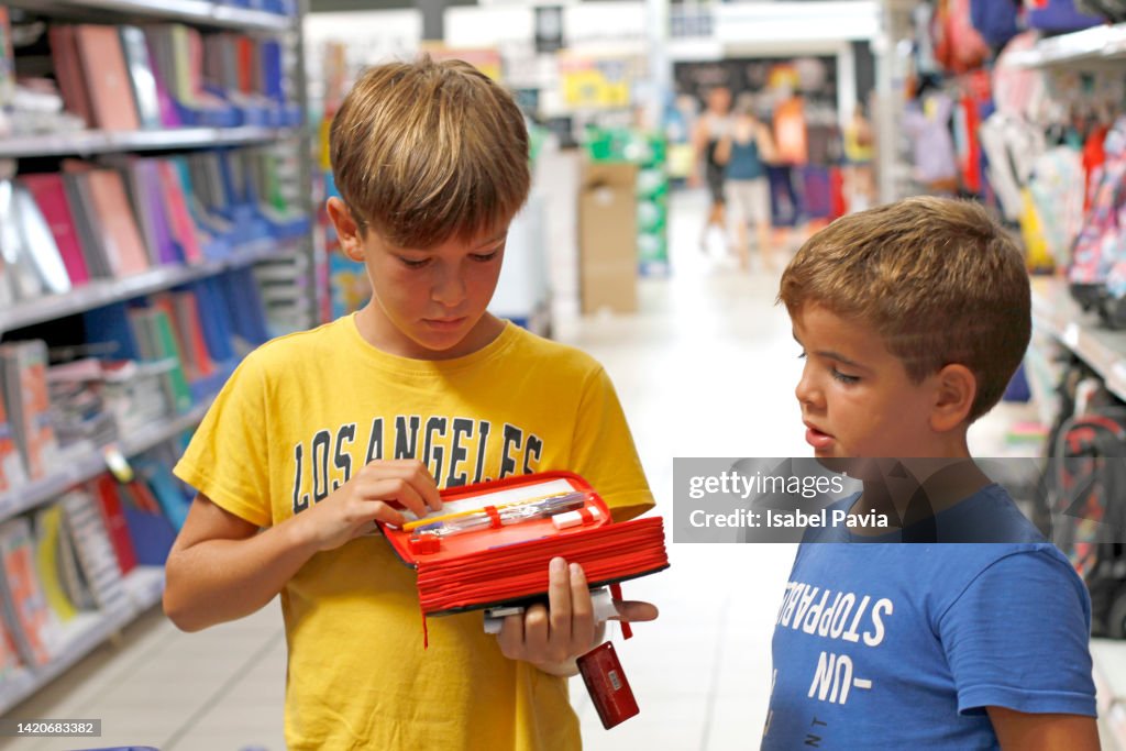 Children looking for 'back to school' stationery in a store