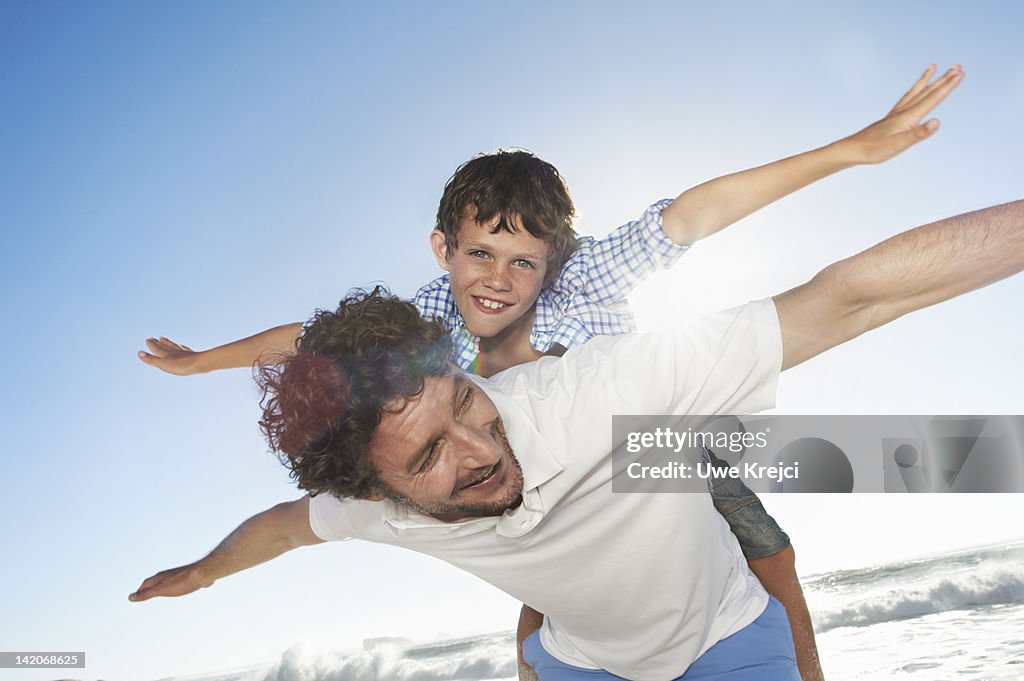 Father playing with son (6 - 8 years)