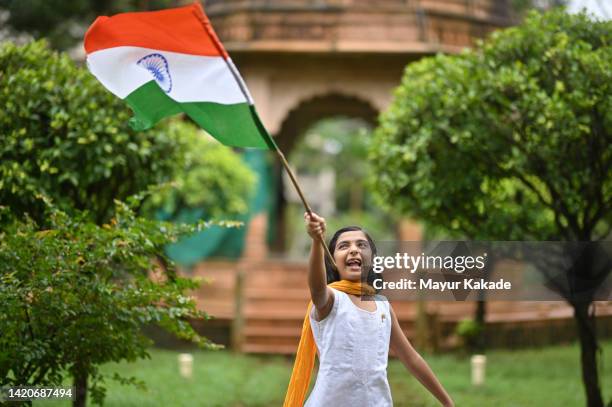 cute girl with an indian flag - indian tricolor stock pictures, royalty-free photos & images