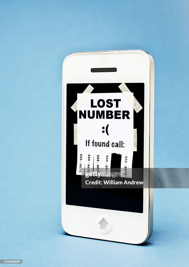'Lost Number' poster taped on a smartphone