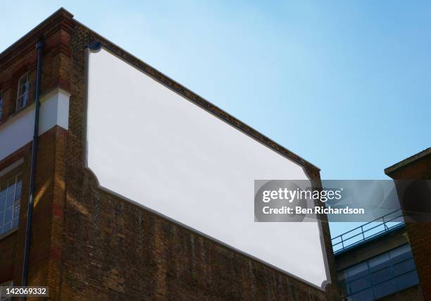 a blank old fashioned bill board on the side of a - billboard wall stock pictures, royalty-free photos & images