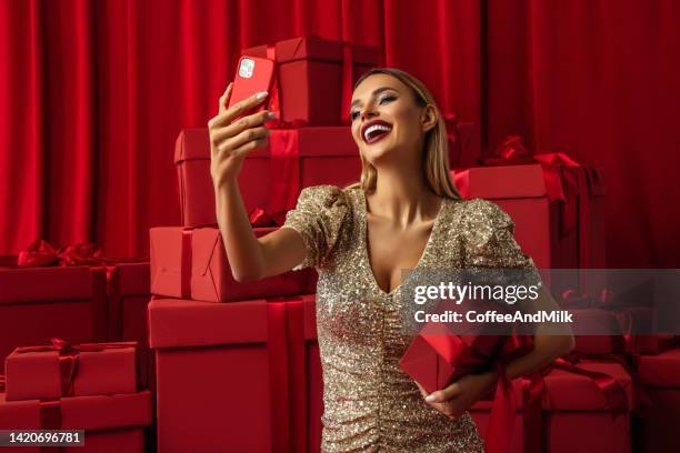 beautiful woman using smart phone - glamour selfie stock pictures, royalty-free photos & images