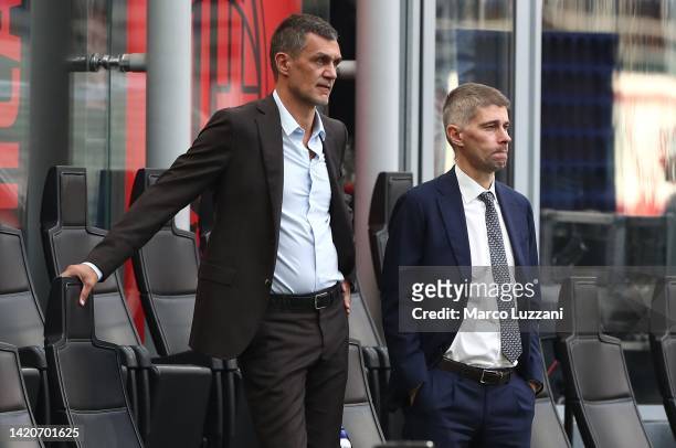 Paolo Maldini and Frederic Massara of AC Milan look on before the Serie A match between AC Milan and FC Internazionale at Stadio Giuseppe Meazza on...