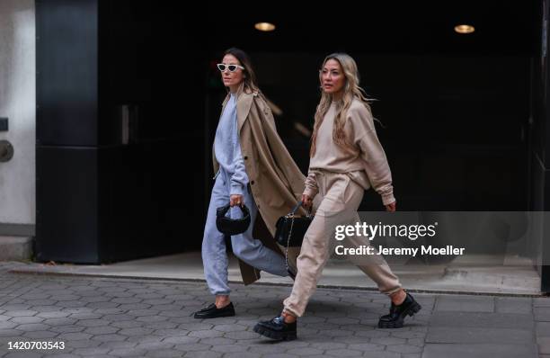 Elise Seitz seen wearing white Celine sunglasses, grey Soho Studios oversize sweater, matching grey Soho Studios jogger pants, beige oversize Soho...