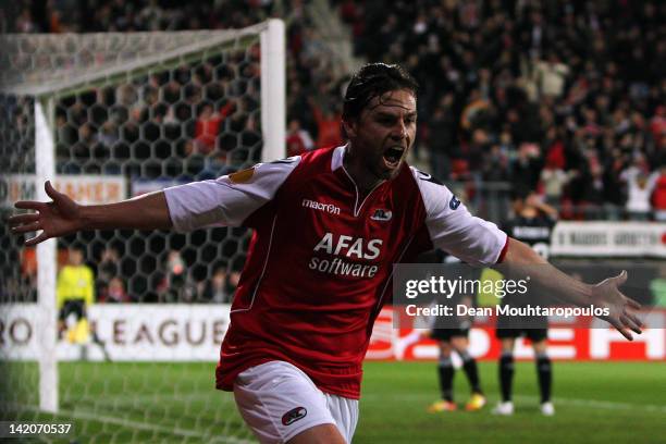 Brett Holman of AZ celebrates scoring the first goal of the game during the UEFA Europa League quarter final first leg match between AZ Alkmaar and...
