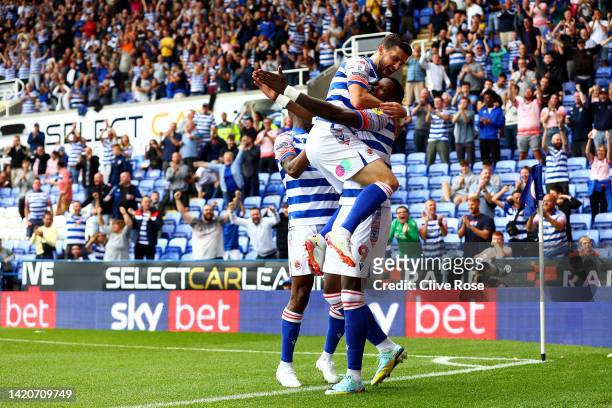 Lucas Joao of Reading celebrates with team mate Shane Long after scoring their sides first goal during the Sky Bet Championship match between Reading...