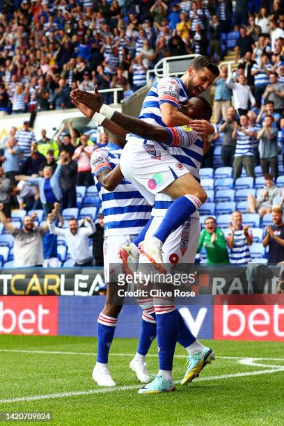 Lucas Joao of Reading celebrates with team mate Shane Long after scoring their sides first goal during the Sky Bet Championship match between Reading...