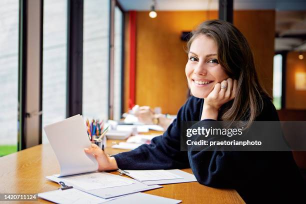 portrait of designer working in an office - editor stock pictures, royalty-free photos & images