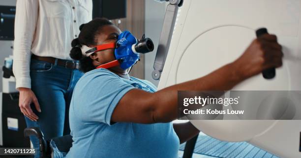 consulting diabetes patient with lung breathing machine, pulmonary healthcare test or spirometry and hospital medical equipment technology. obese woman breathe into oxygen mask with help from doctor - respiratory therapist oxygen stock pictures, royalty-free photos & images