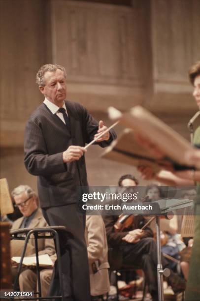 English composer Benjamin Britten conducting, circa 1965.