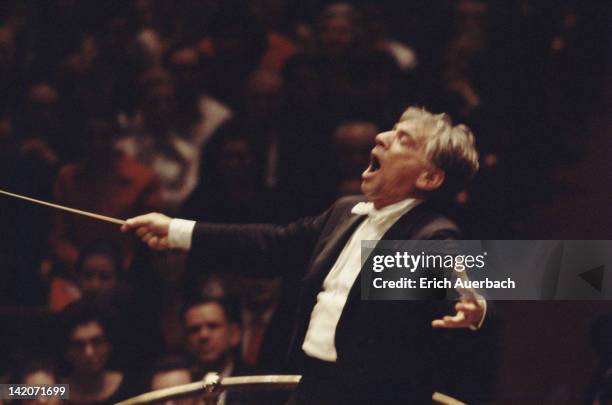 American composer, conductor and pianist Leonard Bernstein conducting, circa 1975.