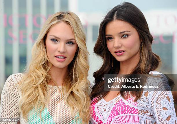 Victoria's Secret Angels Candice Swanepoel and Miranda Kerr launch the 2012 Swim Collection at the Thompson Hotel on March 29, 2012 in Beverly Hills,...